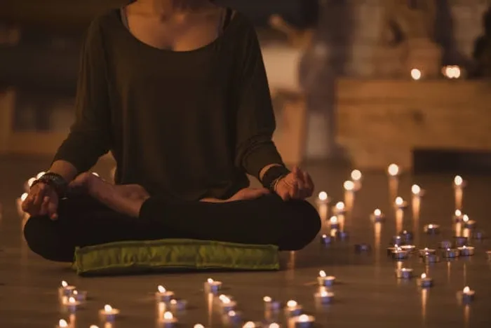 Candlelit restorative yoga setting